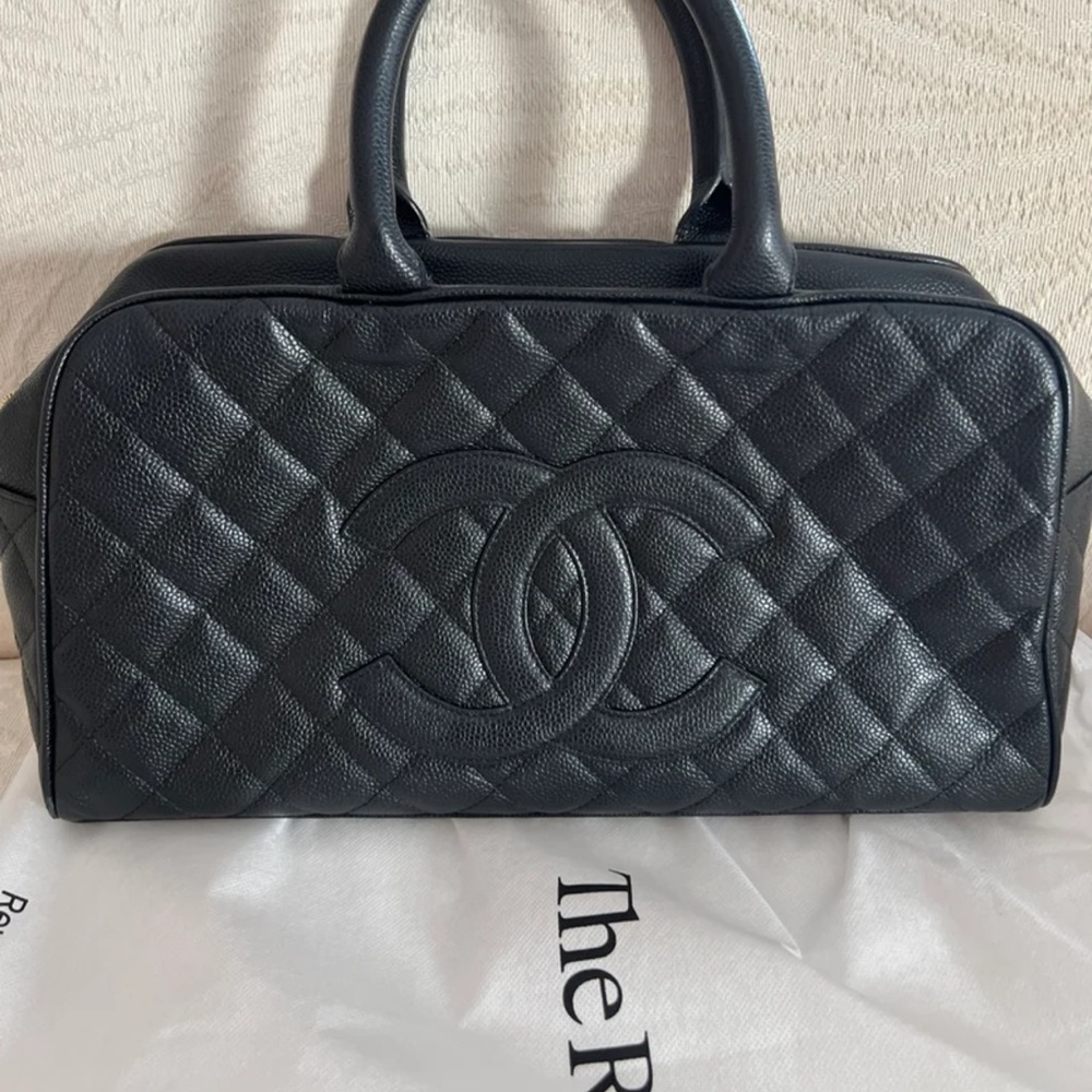 Quilted logo bowler bag.